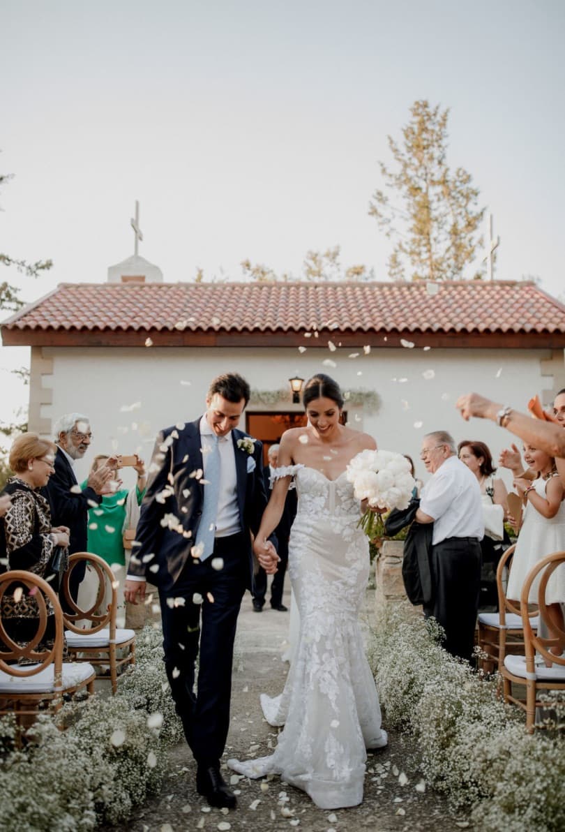 Confetti thrown over a couple leaving the chapel at Lexeko